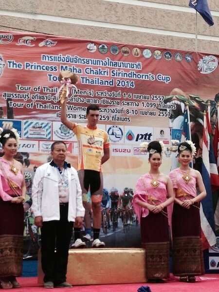 OCBC Singapore Pro Cycling Team rider Eric Sheppard (in yellow jersey) celebrates taking over the yellow jersey after finishing second in Stage 3 of The Princess Maha Chakri Sirindhorn’s Cup Tour of Thailand on Thursday in Lampang, Thailand. (Photo credit: OCBC Singapore Pro Cycling Team)