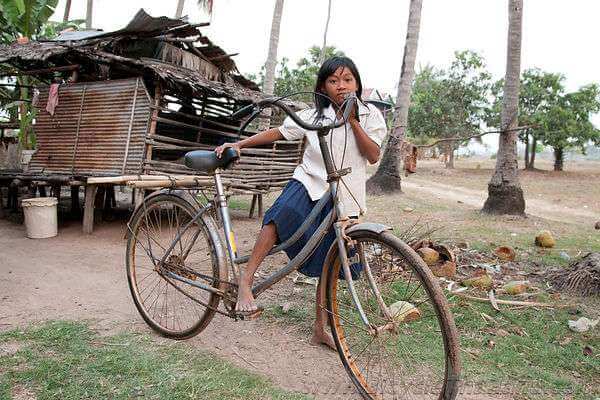 Cambodian Schoolgirl with Bicycle