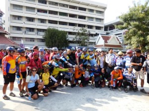 The group of cyclists, including Swiss teacher Corinne Hasle, sitting left front row, pose for a photo on arrival in Chiang Mai.