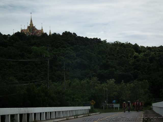 Cycling past one of the many mountain-top temples