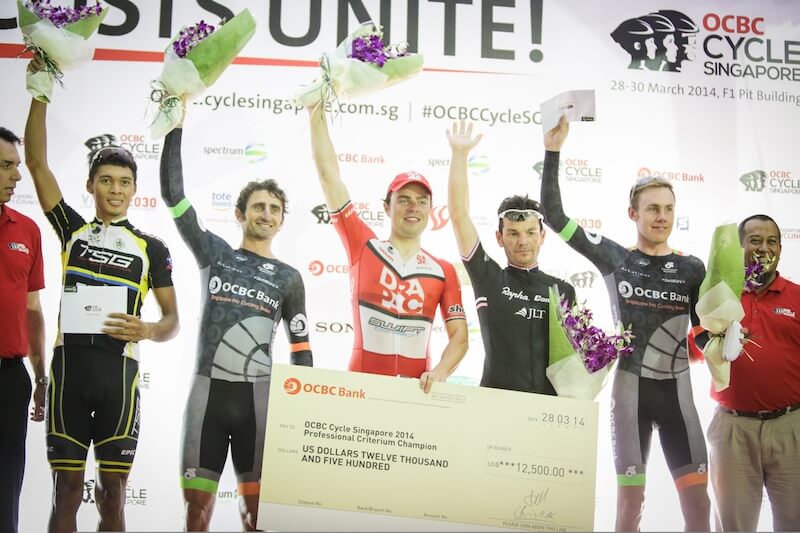 OCBC Singapore Pro Cycling Team rider Cameron Bayly (second from right)celebrates winning the Cycle Asia King of the Sprints title at OCBC Cycle Singapore Professional Criterium on 28 March, at the F1 Pit Building. (Photo Credit: OCBC Singapore Pro Cycling Team)